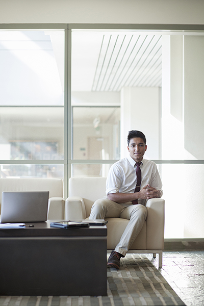 businessman sitting in office lobby